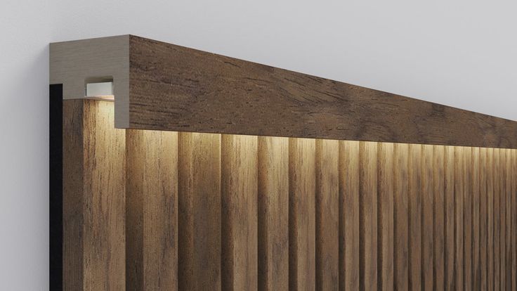 a close up of a wooden headboard with light coming through the wood slats