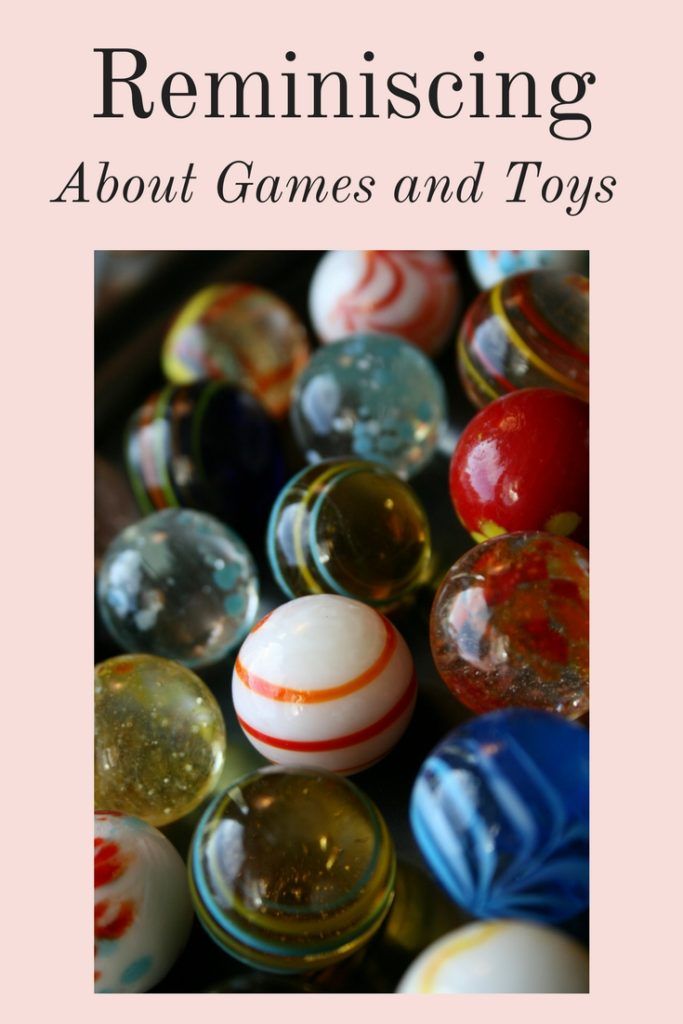 the cover of reminising about games and toys, with an image of marbles