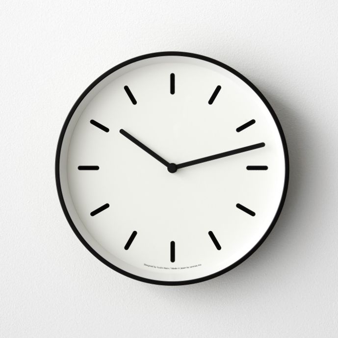 a black and white clock on the wall