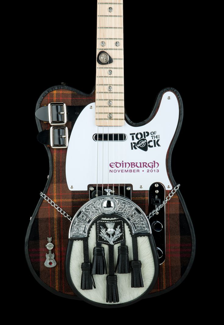 an electric guitar with some decorations on it