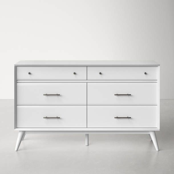 a white dresser sitting on top of a floor