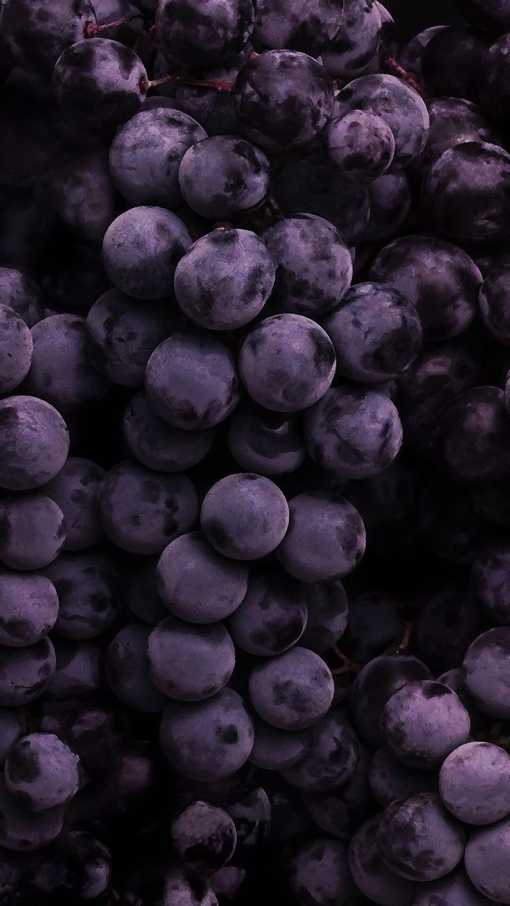 a bunch of blueberries are piled up together