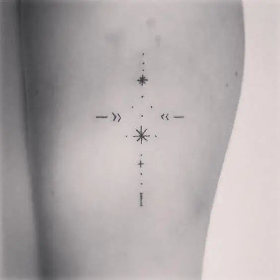 the back of a woman's stomach with arrows and stars on her left side