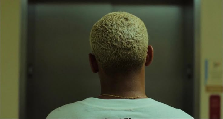 the back of a man's head in an elevator