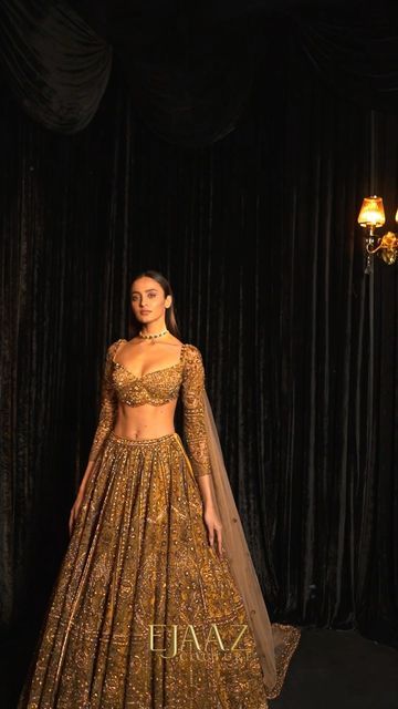 Ejaaz Couture on Instagram: "Hold your breath, or this treasured gold lehenga shall certainly take it away. Glamour is in the details of our gold finery, embellished in crystals and celebratory elements. 𝘚𝘌𝘈𝘚𝘖𝘕’𝘚 𝘋𝘐𝘈𝘔𝘖𝘕𝘋𝘚 Celebratory Couture 2022 Jewelry by @kotawalajewels — Shop with us: ⚜️at our Flagship Store : D 33, First Floor, Defence Colony, New Delhi - 110024 ⚜️Whatsapp : +91-9873789288 ⚜️Website : Link in the bio ⚜️Virtual Consultant : +91-9873789288 For inquiries & appoi Ejaaz Couture, Golden Bridal Lehenga, Gold Lehenga, Indian Wedding Gowns, Latest Bridal Lehenga, Reception Lehenga, Indian Bride Outfits, Indian Bridal Lehenga, Indian Dresses Traditional