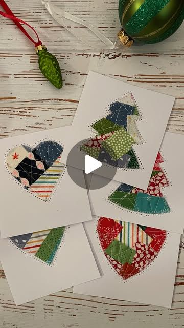 four cards with different designs on them next to a christmas ornament and ornaments