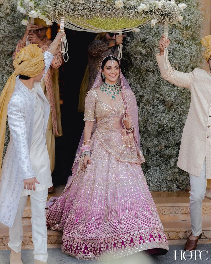 @kiaraaliaadvani looking absolutely gorgeous walking down the aisle to the love of her life @sidmalhotra 💫 We love her stunning lehenga in the hues of pink paired with contrasting emerald jewelry 😍 Kiara Wedding, Pink Bridal Lehenga, Latest Bridal Lehenga, Indian Outfits Lehenga, Wedding Lehenga Designs, Bridal Lehenga Collection, Walk Down The Aisle, Indian Bridal Dress, Indian Dresses Traditional