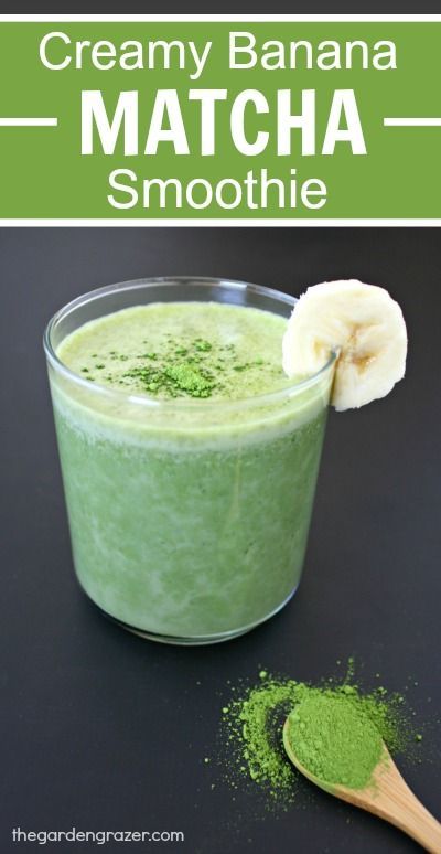 creamy banana matcha smoothie in a glass with a wooden spoon