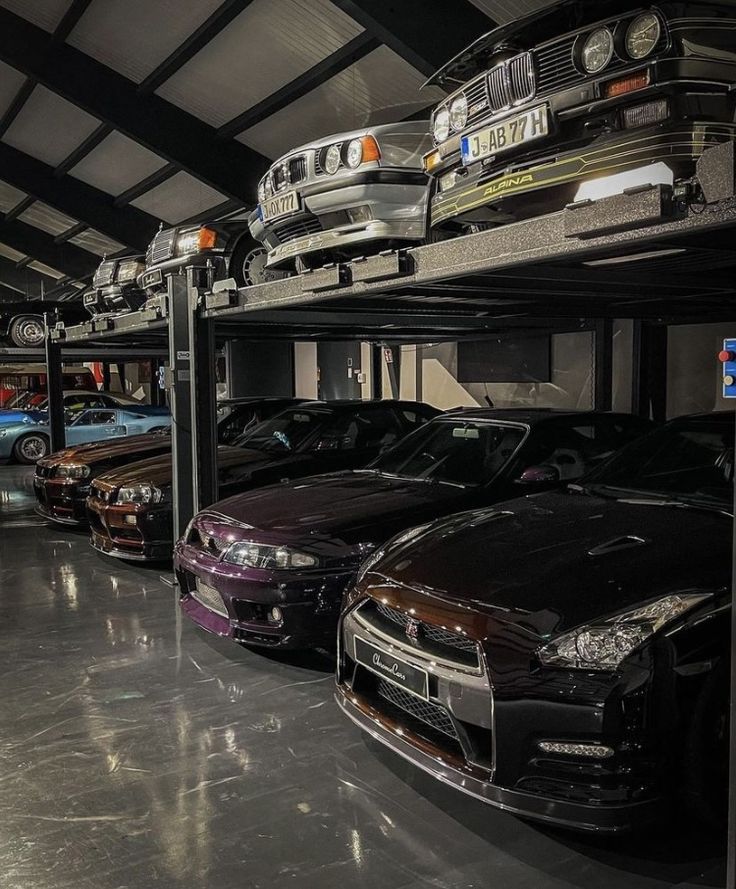 there are many cars parked in the garage