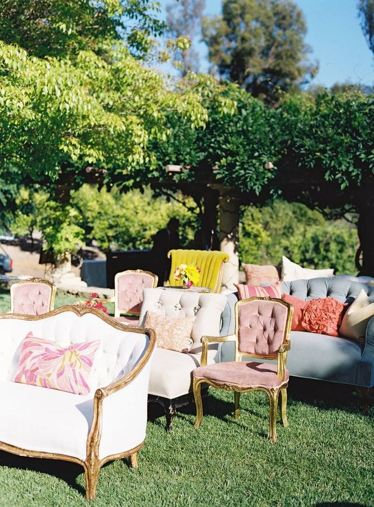 an instagram page with chairs and pillows on the grass in front of some trees