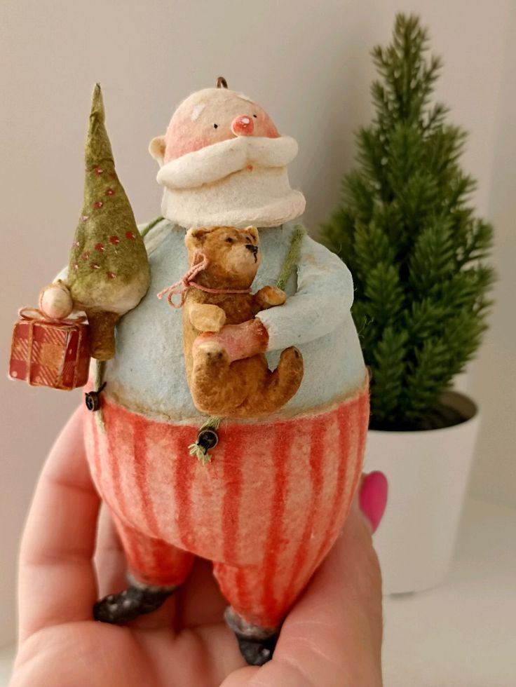 there is a small figurine in the shape of a cupcake with a bear on top