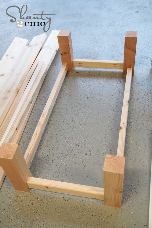 the frame is made out of wood and ready to be used as a bed frame