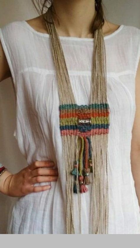 a woman wearing a white shirt and multicolored beaded necklace