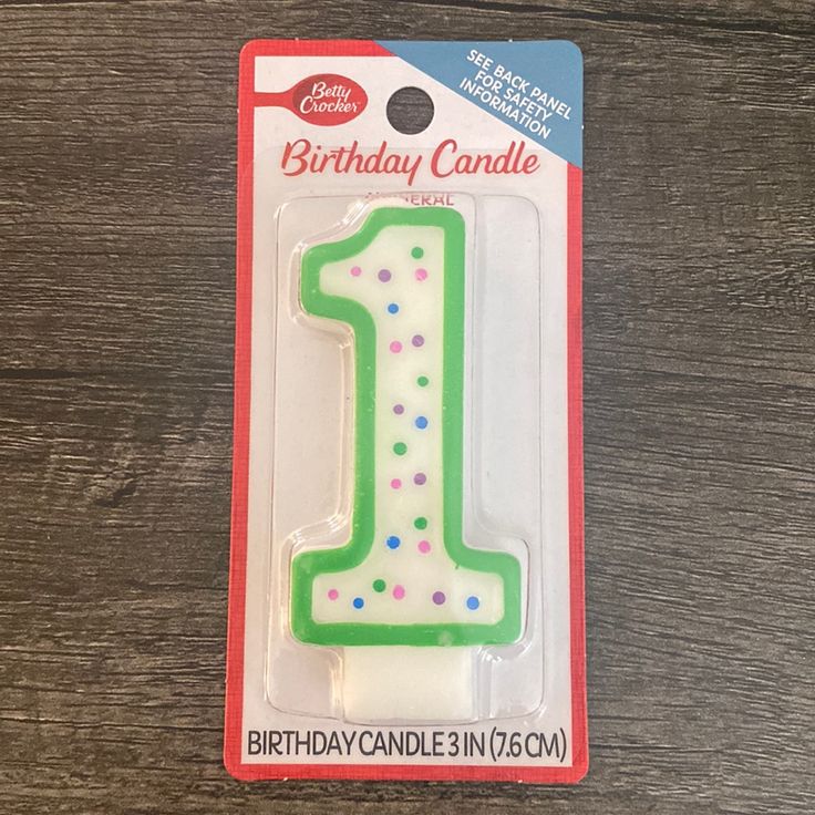 a birthday candle in the shape of a 1