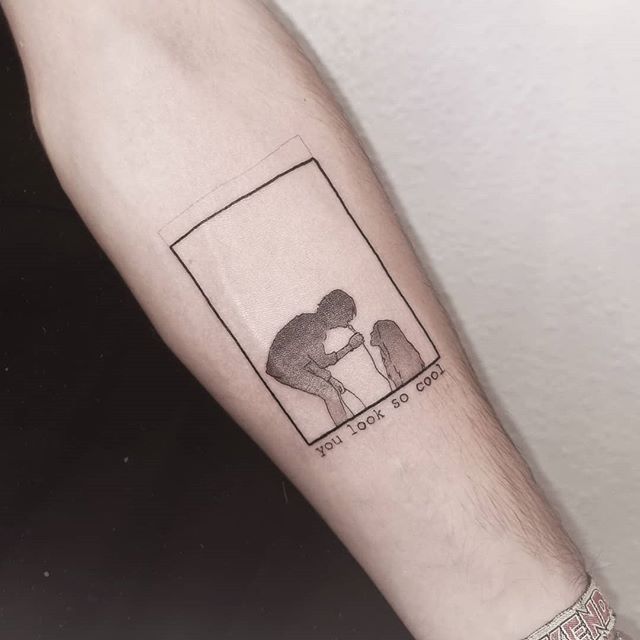 a person with a small tattoo on their arm