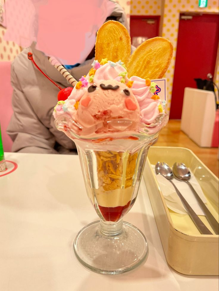 an ice cream sundae with bunny ears on top