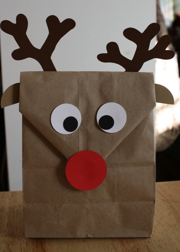 a brown paper bag with reindeer's nose and nose on it