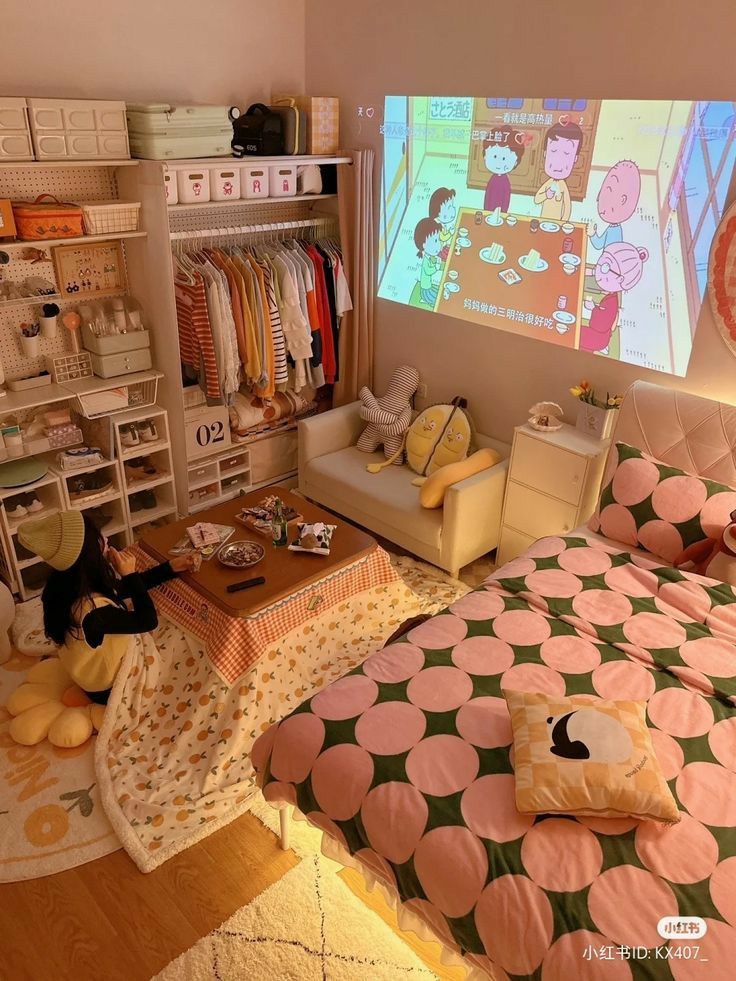 a bed room with a neatly made bed and a projector screen on the wall