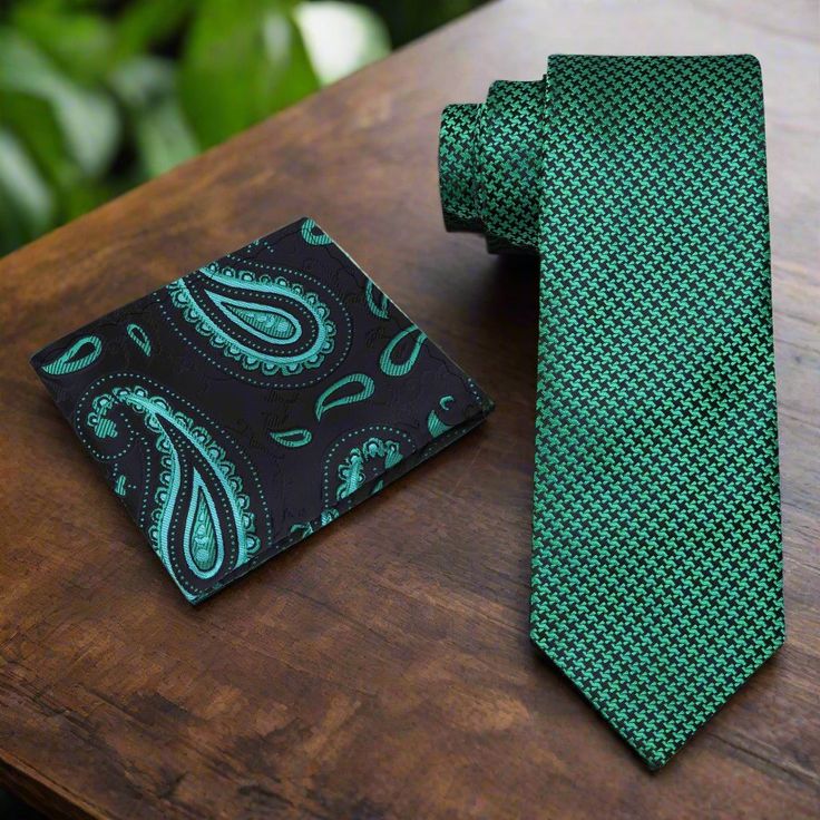 Elevate your ensemble with this sophisticated necktie featuring a timeless houndstooth pattern in shades of green and black. Crafted with meticulous attention to detail, this versatile accessory effortlessly combines classic style with modern elegance, making it a must-have addition to any wardrobe. Suggestions: Dress Shirt: Crisp White: Provides a clean and polished backdrop that allows the green and black hues of the tie to stand out, ensuring a timeless and refined look. Light Gray: Offers a Elegant Green Formal Neckwear, Green Formal Neckwear With Ties, Formal Green Ties, Classic Green Suit And Tie Accessories, Classic Green Neckwear For Business, Classic Green Neckwear With Ties, Classic Green Suit And Tie Accessories For Semi-formal, Classic Green Suit And Tie Accessories For Semi-formal Occasions, Classic Green Tie For Semi-formal Occasions