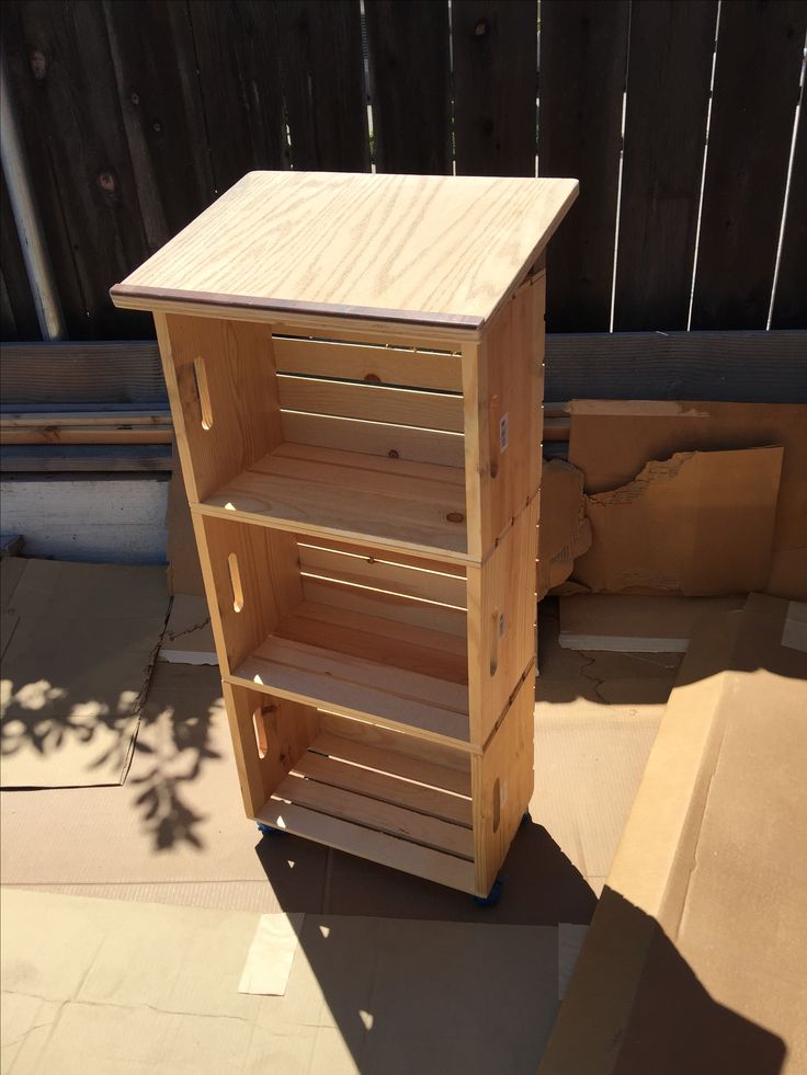 a wooden shelf sitting on top of a patio