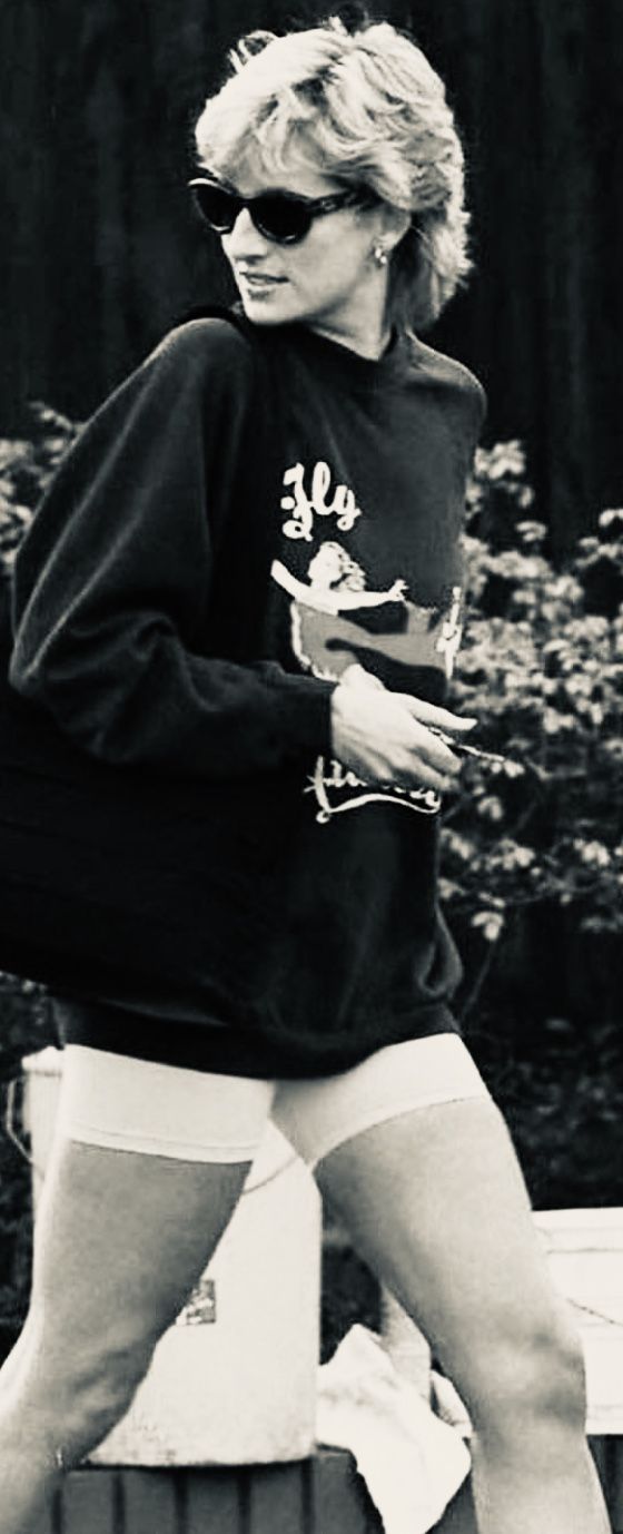 black and white photograph of a woman walking