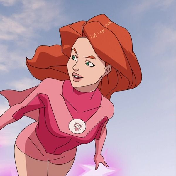 a woman with red hair is flying through the air