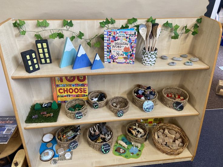 a book shelf filled with lots of books and toys