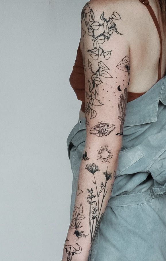 a woman with a tattoo on her arm