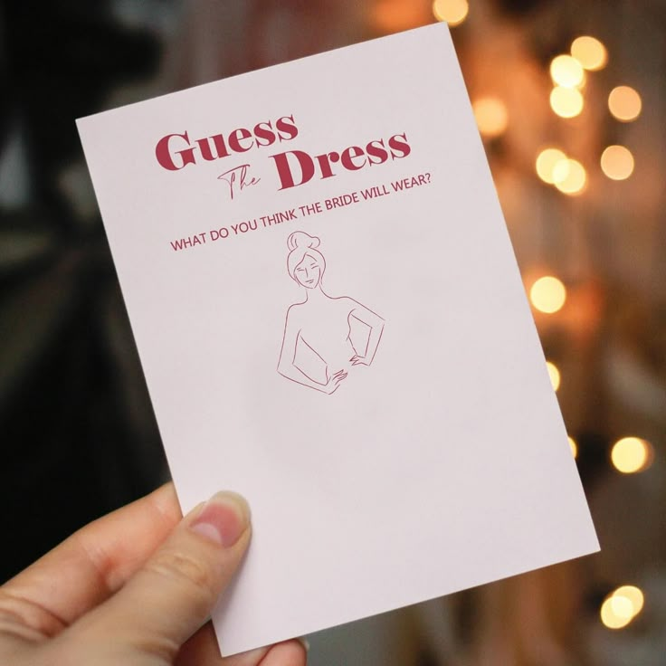 a person holding up a piece of paper that says guess the dress what do you think the bride will wear?