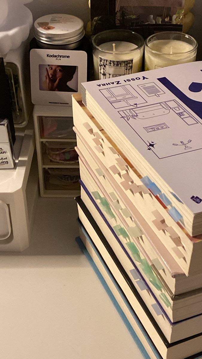 a stack of books sitting on top of a counter