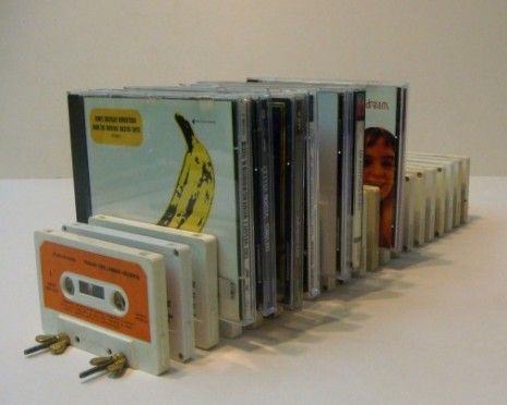 an assortment of cassettes are stacked on top of each other in order to be used