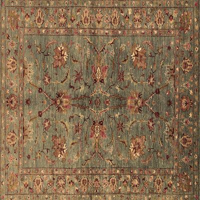 an antique rug with many different colors and designs on the carpet, including red flowers