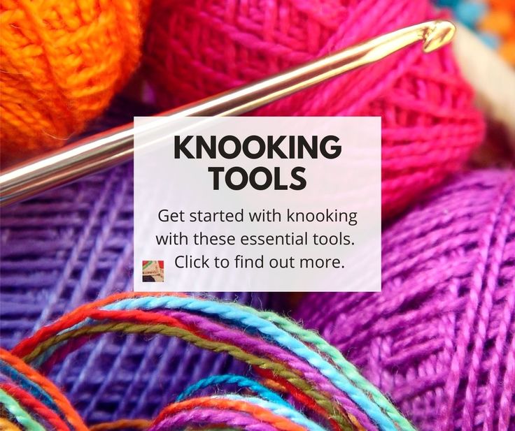 yarn and knitting needles with a sign that says learn to knit it's both crochet & knitting click to find out more