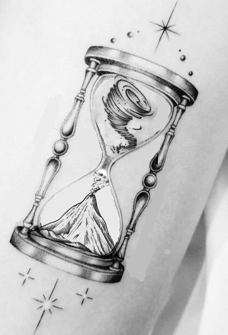 a black and white photo of an hourglass tattoo on the right thigh with stars in the background