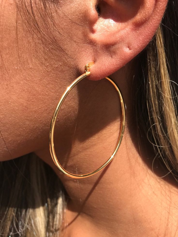 18kt Gold Filled Large Ridged Hoop Earrings Hoop Size: 60mm Width: 2mm Clasp: Hinged Material: 18 Karat Gold Filled, Hypoallergenic. Tarnish Resistant. Gold-filled does not de-laminate or peel like Gold plated Jewelry nor does it tarnish as readily as silver. Generally speaking, gold filled is better quality and will have a much longer lasting color than plated jewelry. We recommend keeping abrasive chemicals away from the jewelry for the items to last. Thank you for visiting and supporting our Hoops Earrings Big, Gold Hoop Earrings Large, Gold Hoops Large, Large Hoop Earrings Aesthetic, Hops Earrings Gold, Gold Hope Earrings, Golden Hoops Earrings, Gold Hoops Aesthetic, Big Hoops Earrings