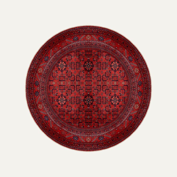 a red rug with an intricate design on the center and sides, is shown in front of a white background