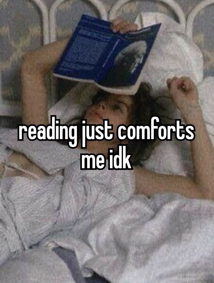 a woman laying in bed reading a book with the words reading just comforts me idk