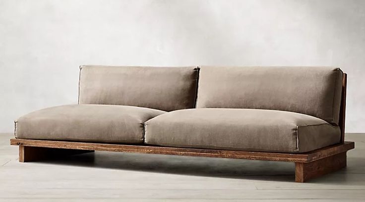 a couch sitting on top of a wooden frame