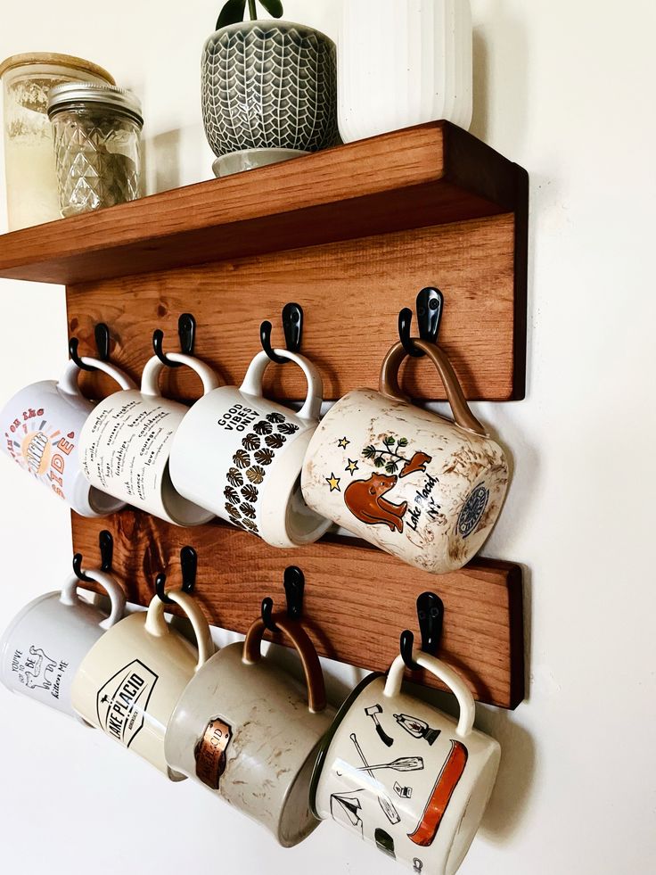 a wooden shelf holding coffee cups and mugs