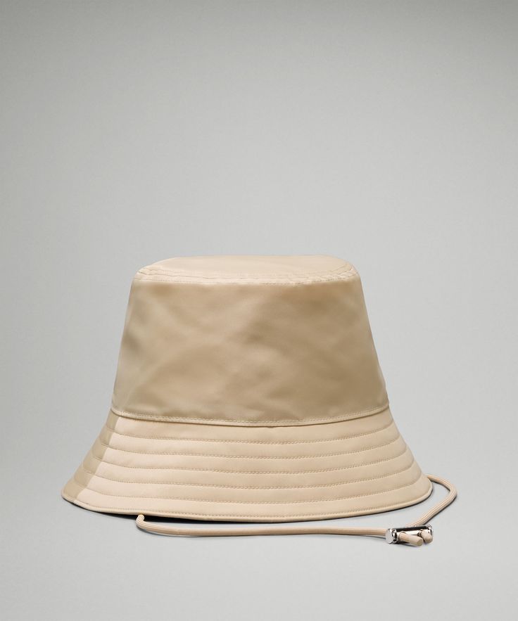 Made of a sleek fabric with a subtle shine, this bucket hat turns any look into a style statement. Designed for Casual. Adjustable chin strap can be removed when not in use. Style Bucket Hat, Bucket Hat Women, Bucket Hat White, Loungewear Women, Short Socks, Style Statement, A Style, Leggings Shop, Color Khaki