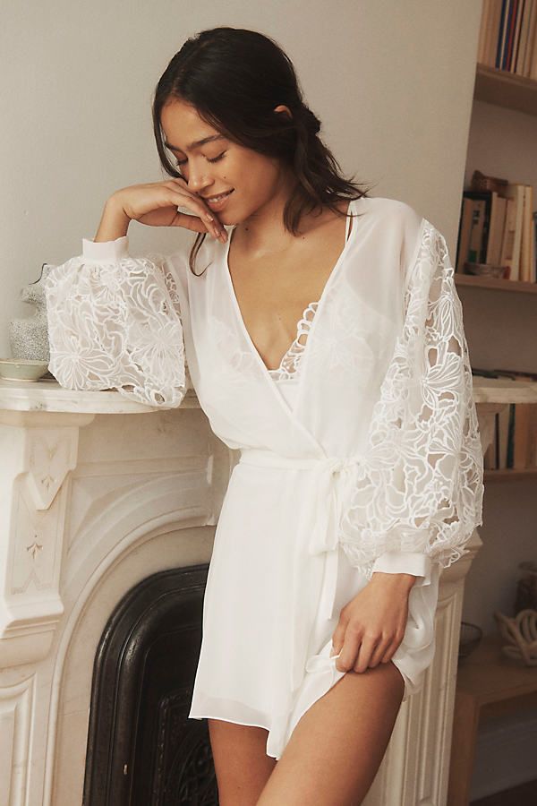 Wrap yourself in the ethereal embrace of the Rya Collection Milos Cover-Up Robe, where delicate lace whispers secrets of summer nights. | Milos Lace-Sleeve Cover-Up Robe by Rya Collection in White, Women's, Size: XL, Polyester at Anthropologie Strapless Robe, Night Robe Lace, Plus Size Honeymoon Night, White Robes Bride, Bridal Getting Ready Loungewear, Wedding Pajamas Dress, Bridal Get Ready Robes, Wedding Silk Robes, Robe Over Wedding Dress