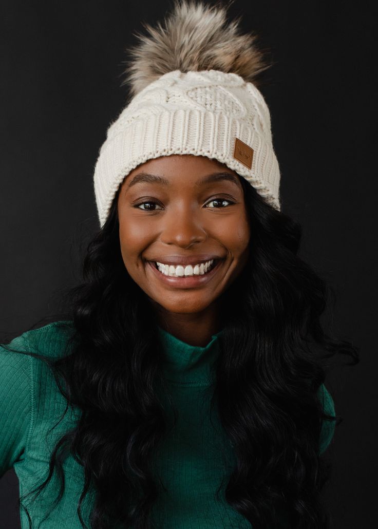 Beige cable knit hat Natural faux fur pom accent Fleece lined Crown patch on the left side One size 100% Acrylic Pairs with matching mittens Ellwood Mittens Cable Knit Hat, Animal Books, Faux Fur Pom Pom, Pom Pom Hat, Fur Pom Pom, Cozy Knits, Knit Hat, Cardigan Tops, Bottom Clothes