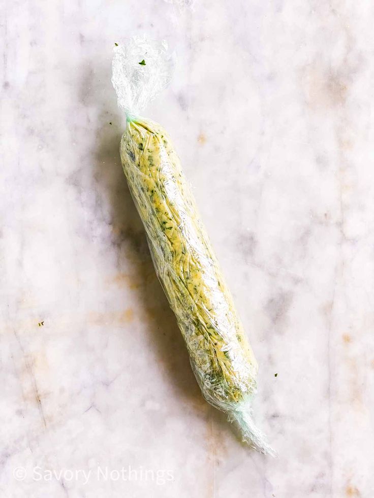 an unwrapped piece of food sitting on top of a marble countertop