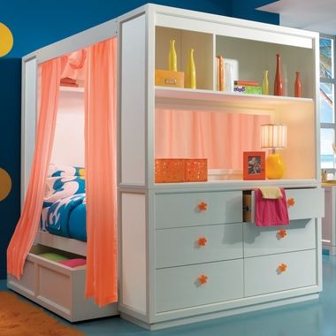 a child's bedroom with blue walls and yellow polka dots on the ceiling, along with white furniture