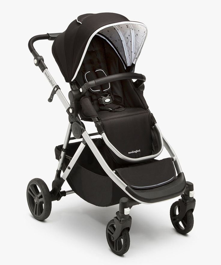 the stroller is black and white with silver trim