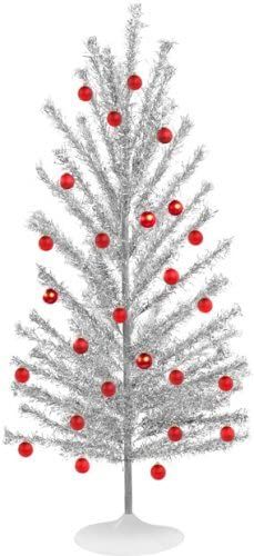 a white christmas tree with red ornaments on it's top and silver tinsel