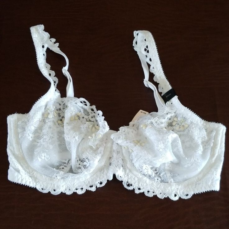 White Lace Bra With Cream Colored Beading And Rhinestones In The Center. Fitted Lace Trim Bra For Wedding, White Underwire Bra For Wedding, White Fitted Bra For Party, Fitted White Bra For Party, Lace Sheer Bra For Wedding, Fitted White Lace Bra, White Delicate Lace Fitted Bra, Elegant White Party Bra, Elegant White Summer Bra