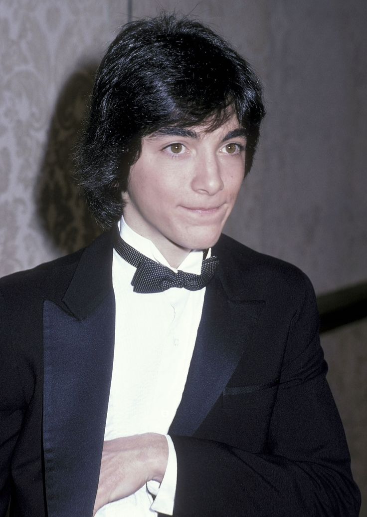 a young man in a tuxedo and bow tie