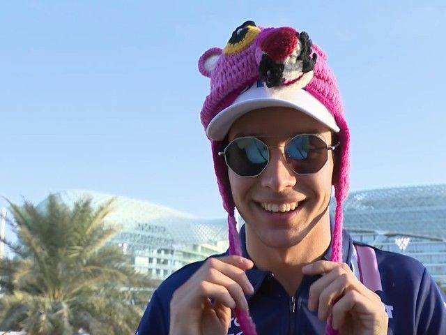 a man wearing a pink hat and sunglasses