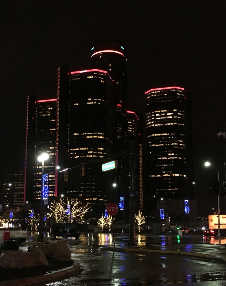 the city is lit up at night with christmas lights